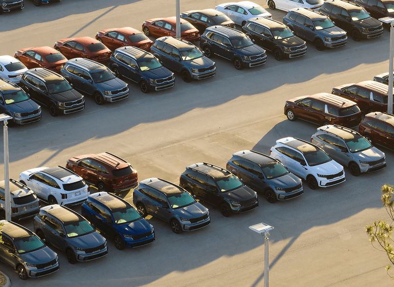 Assorted cars lined up outdoors
