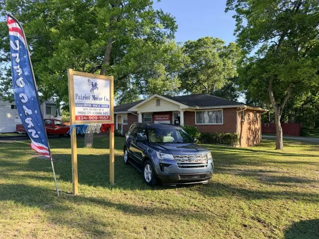 Car dealership with parked SUV