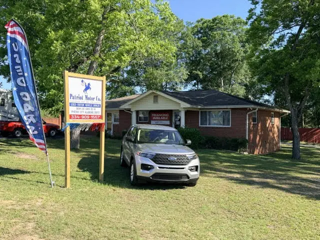Brick building with dealership sign