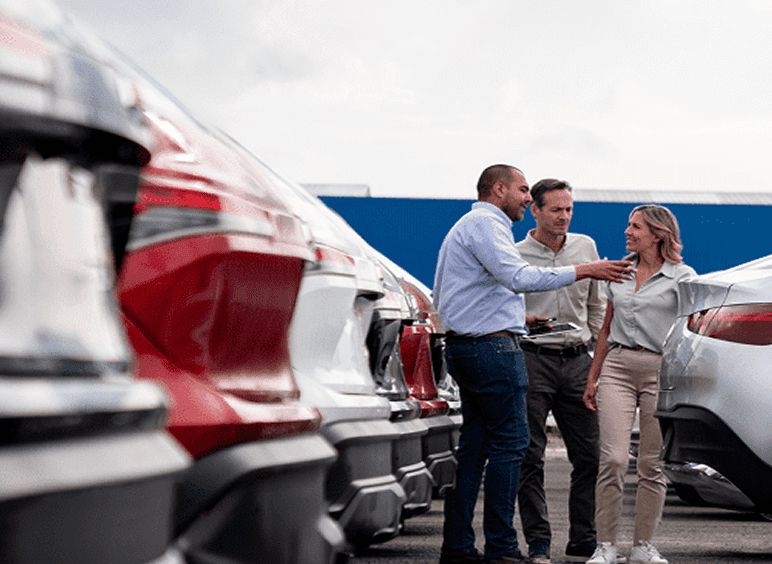 Automotive sales team in conversation